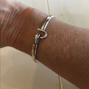 Sterling silver “love” bracelet.